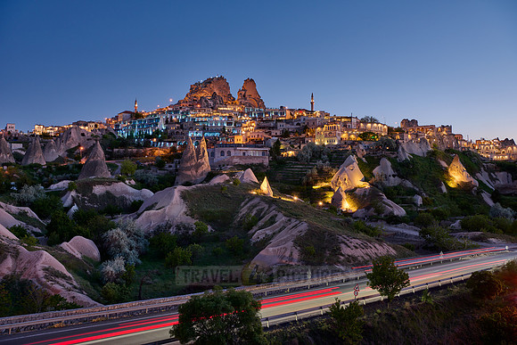 Twilight photo of the perforated castle rock of Uçhisar