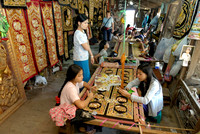 women stitching tapestries