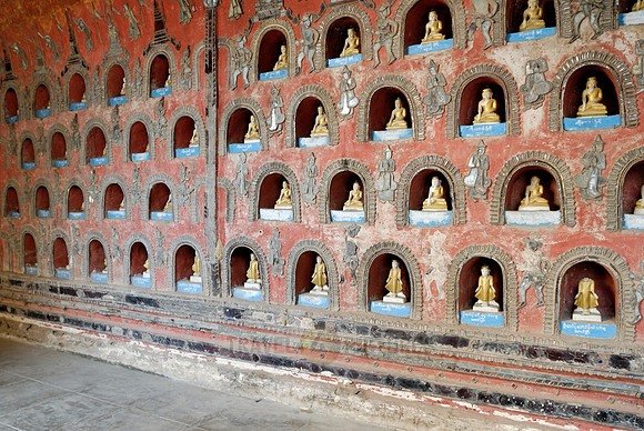 many small Budda figures in niches