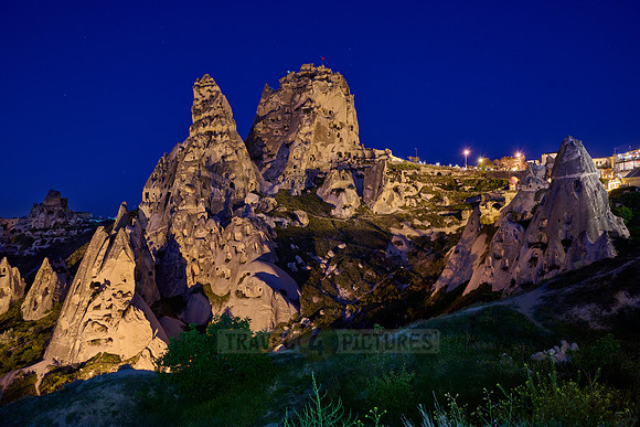 Twilight photo of the perforated castle rock of Uçhisar