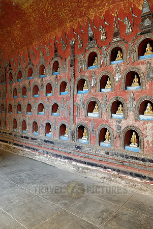 many small Budda figures in niches