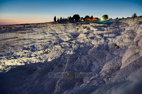 illuminated Pamukkale travertine terraces after sunset