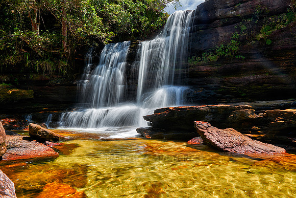 a waterfall at Cano Cristales