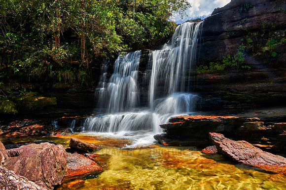 a waterfall at Cano Cristales