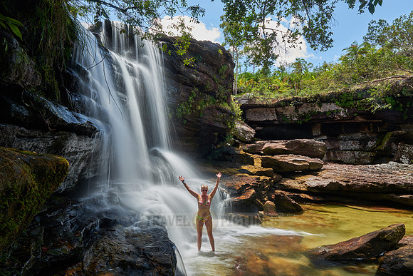 woman at waterfall at Cano Cristales