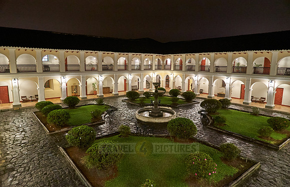 night shot of inner courtyard of Hotel Dann Monasterio