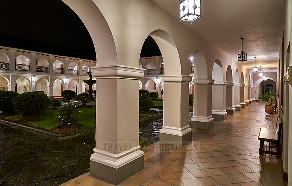 night shot of inner courtyard of Hotel Dann Monasterio