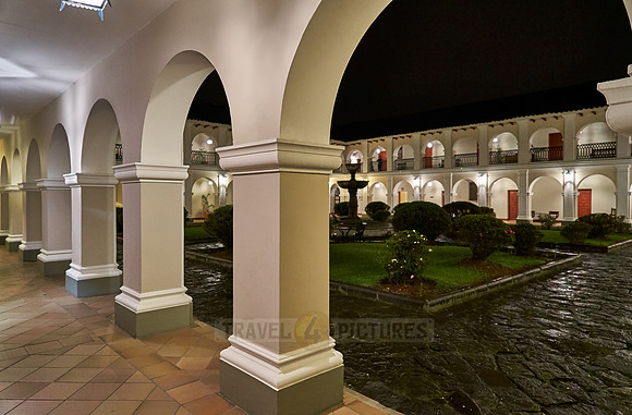 night shot of inner courtyard of Hotel Dann Monasterio