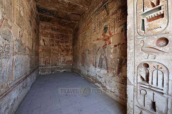 room with colorful bas-reliefs beside column hall