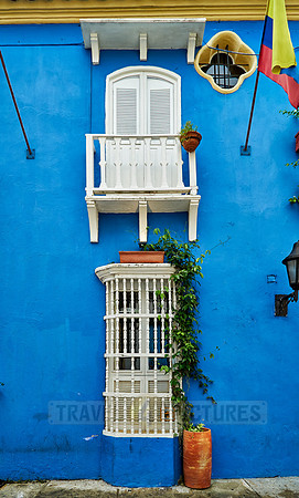 blue facade with barred windows