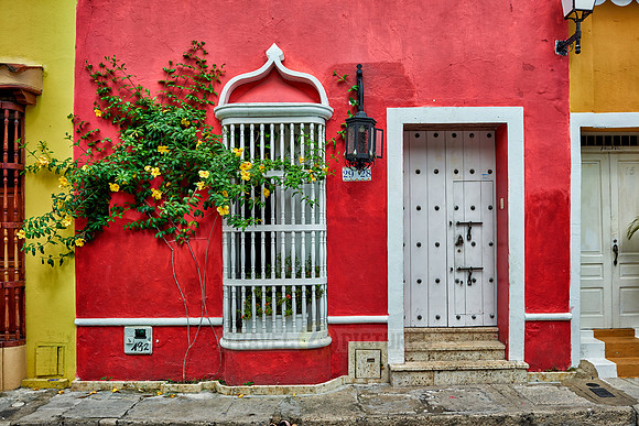 typical colorful facades with balconies and flowers