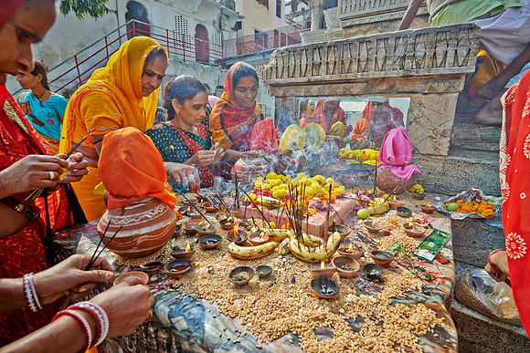 colorful hindu women during ceremony