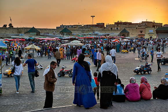 people on Lahdim Square at sunset