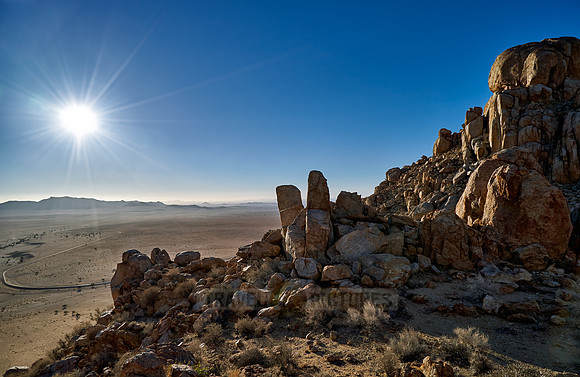 view from mountain on desert landscape with burning sun of farm Klein-Aus Vista