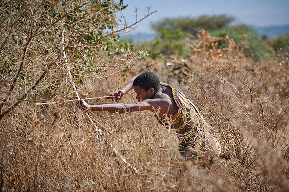 hunting bushmen of Hadza tribe with bow and arrow