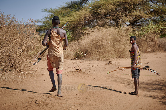 hunting bushmen of Hadza tribe with bow and arrow