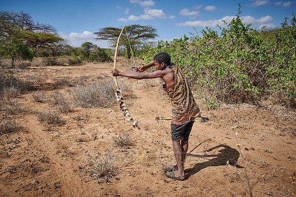 hunting bushmen of Hadza tribe with bow and arrow