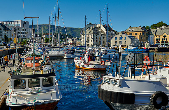 small fishing vessel in old harbor of Alesund