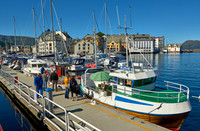 small fishing vessel in old harbor of Alesund