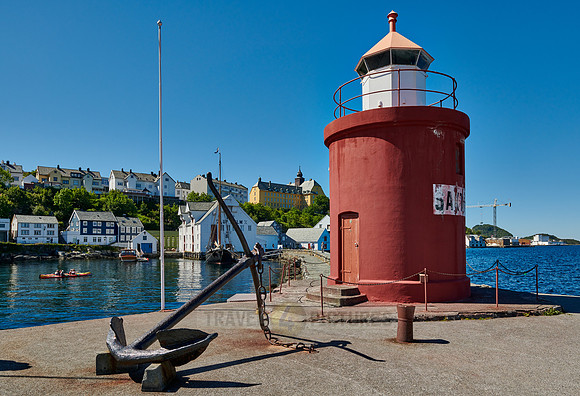 lighthouse and anchor  at entrance of old harbor
