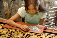 women stitching tapestries