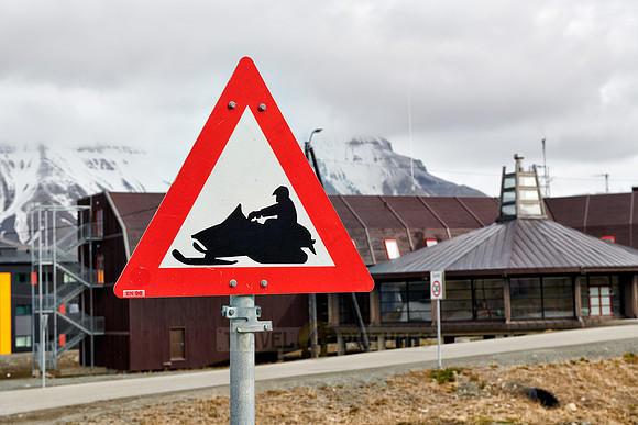 warning sign beware of snow scooter