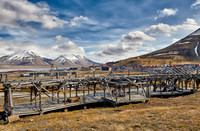 old construction of a cable car in front of mountains