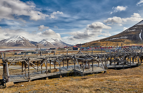 old construction of a cable car in front of mountains