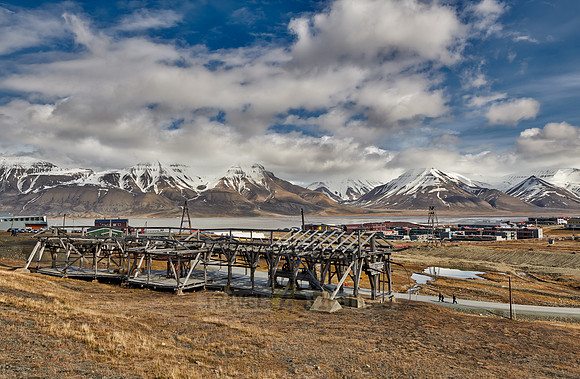 old construction of a cable car in front of mountains