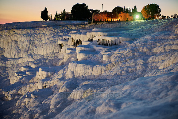 illuminated Pamukkale travertine terraces after sunset
