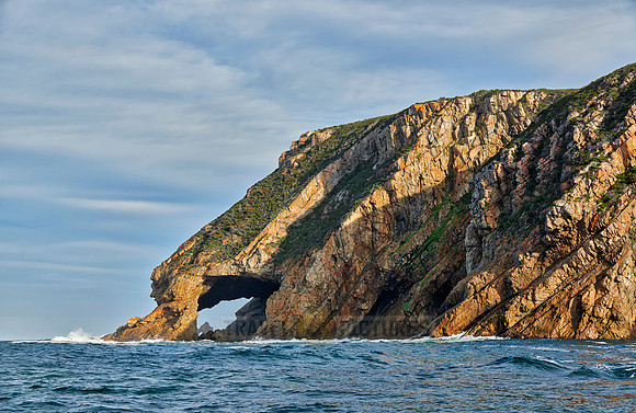cliffs and cave at coastline