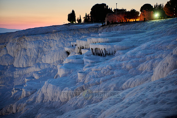 illuminated Pamukkale travertine terraces after sunset