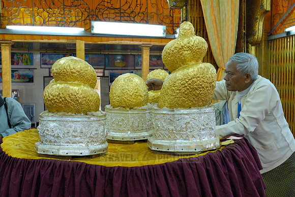 Buddha figures with thick layer of gold leaf in Phaung Daw U Pagoda