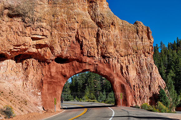 Road through arch in Red Canyon