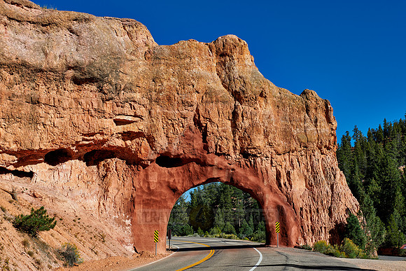 Road through arch in Red Canyon