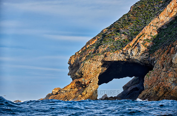 cliffs and cave at coastline