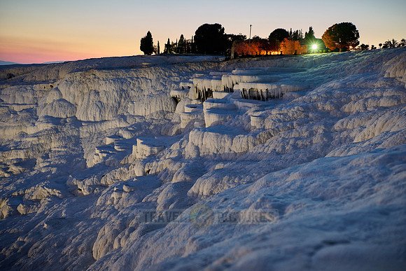 illuminated Pamukkale travertine terraces after sunset