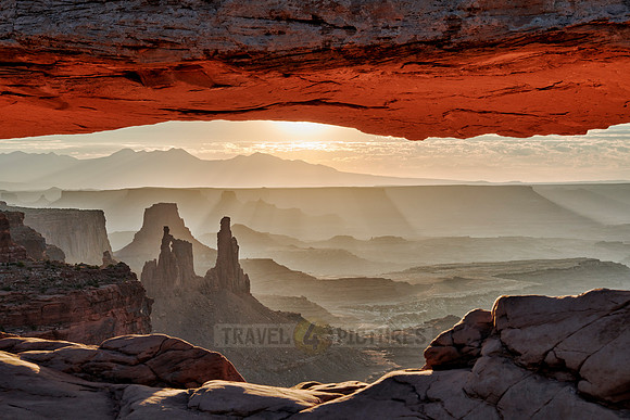 sun rises at Mesa Arch in Canyonlands National Park