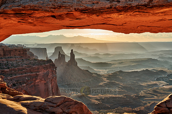 sun rises at Mesa Arch in Canyonlands National Park