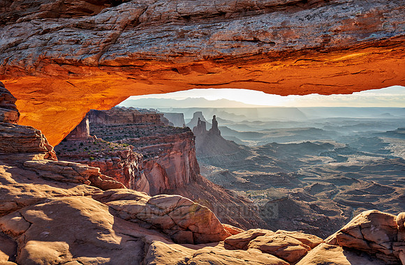 sun rises at Mesa Arch in Canyonlands National Park