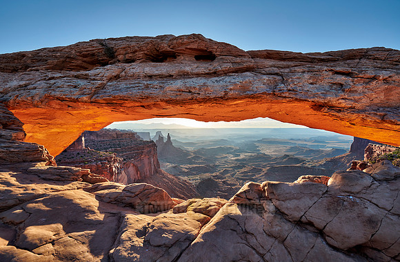 sun rises at Mesa Arch in Canyonlands National Park