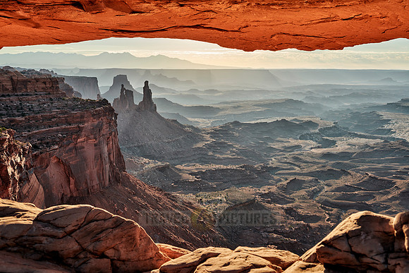 sun rises at Mesa Arch in Canyonlands National Park