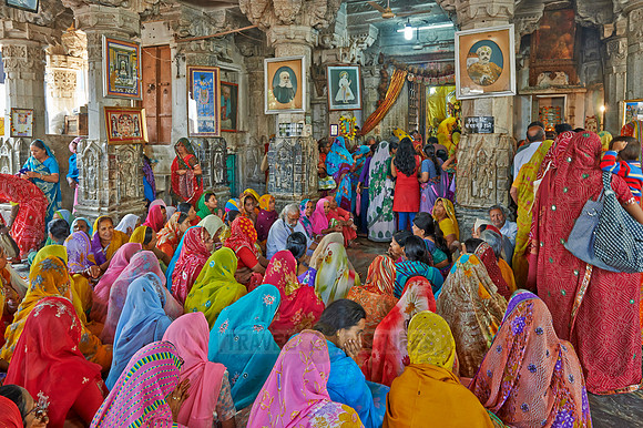 colorful hindu women during ceremony