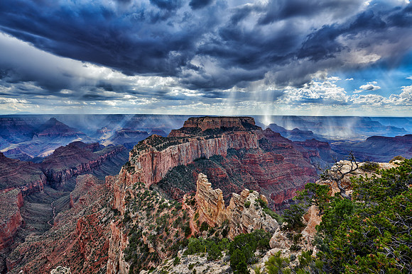thunderstorm and sun beams over Grand Canyon