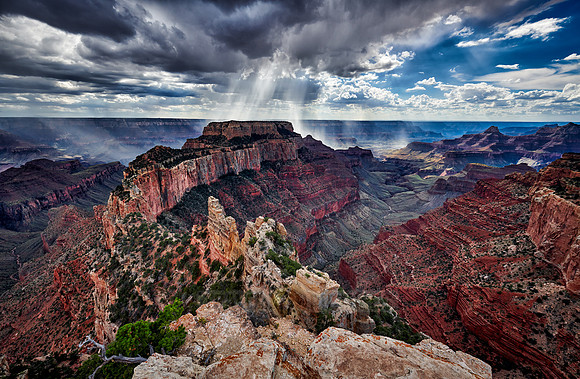 thunderstorm and sun beams over Grand Canyon