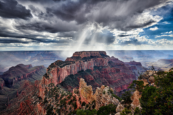 thunderstorm and sun beams over Grand Canyon