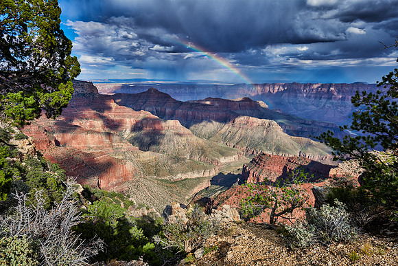 thunderstorm and rainbow over Grand Canyon
