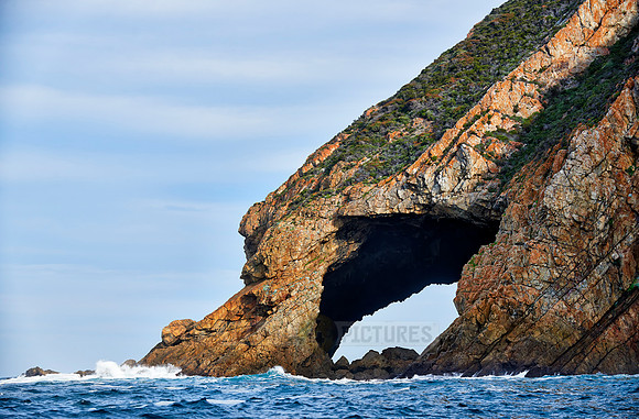 cliffs and cave at coastline