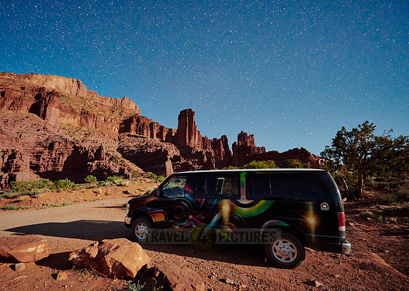 camper, night sky and milky way above Fisher Towers
