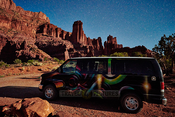 camper, night sky and milky way above Fisher Towers